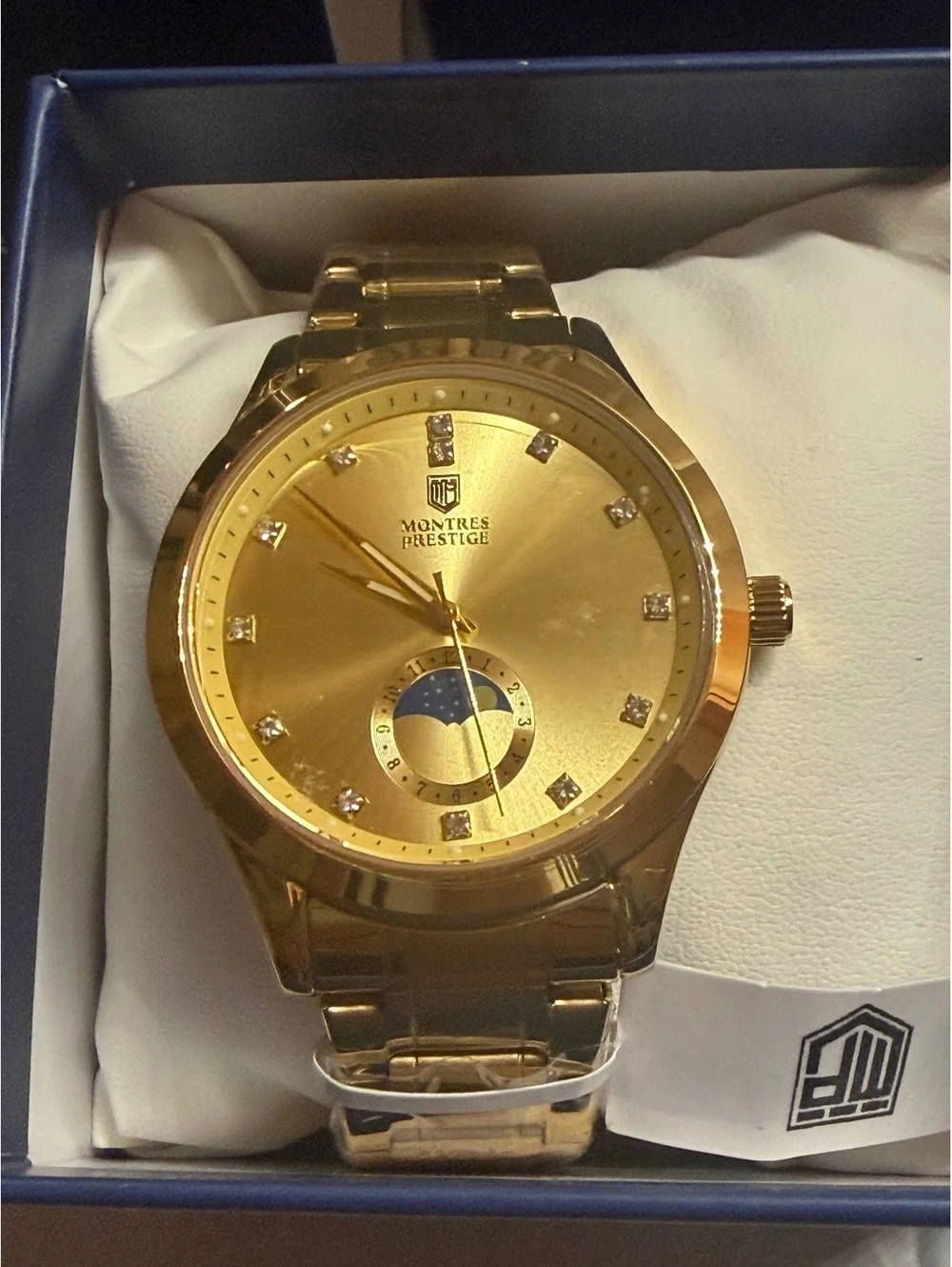 Montres Prestige gold-tone watch with moonphase dial